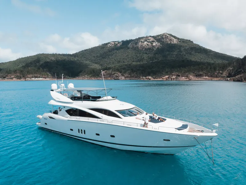 M/Y Alani, at anchor beneath the island peaks