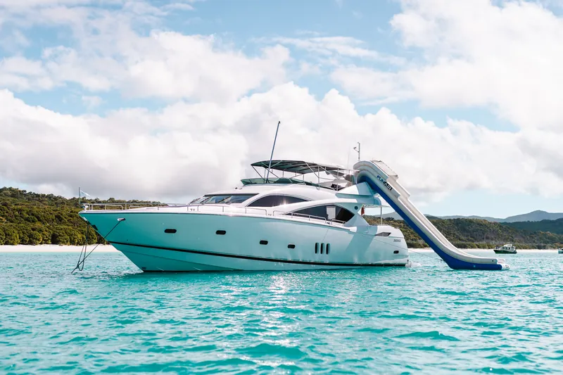 M/Y Alani, at anchor with the FunAir waterslide rigged from the top deck