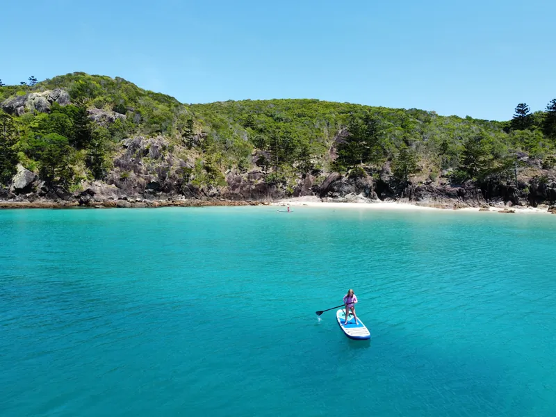 M/Y Alani, paddleboarding off an island anchorage