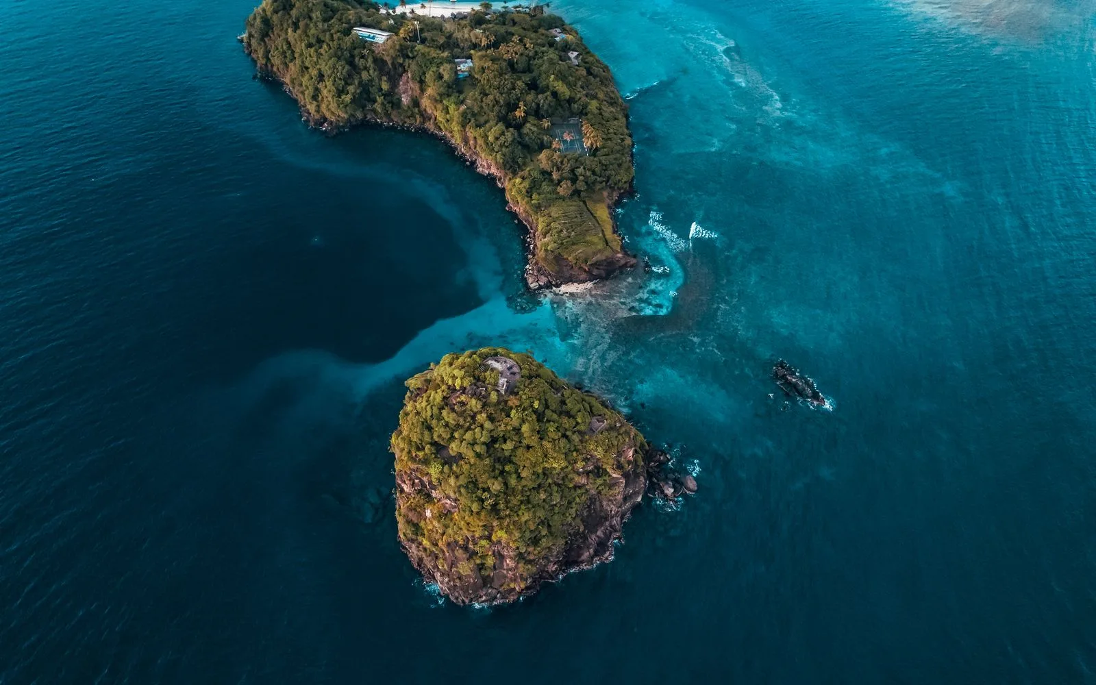A remote Grenadines island ringed by blue water