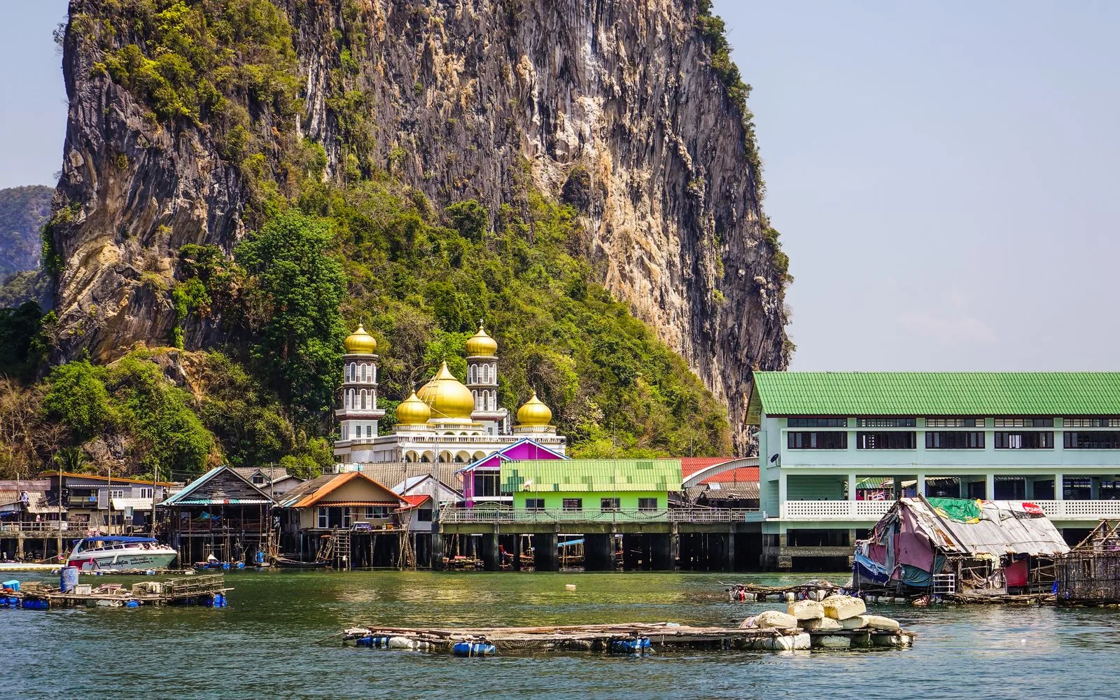 Ko Panyi stilt village below a limestone cliff