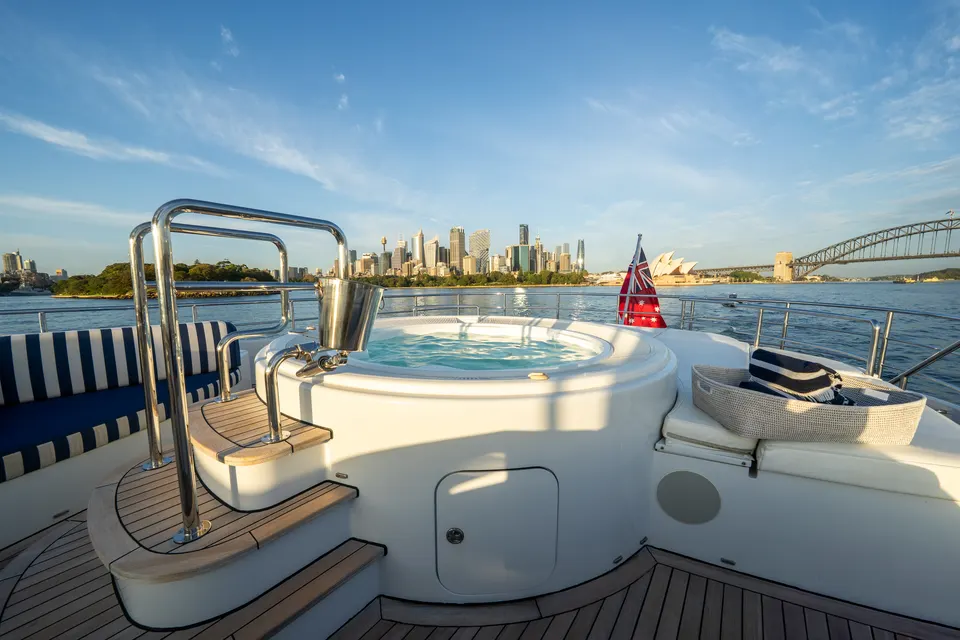M/Y Lumir, Sun deck spa pool with the city behind