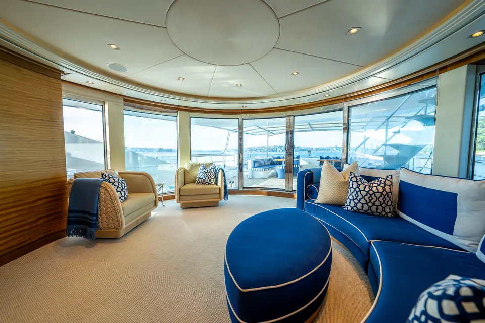 M/Y Lumir, Main salon with curved blue sofas