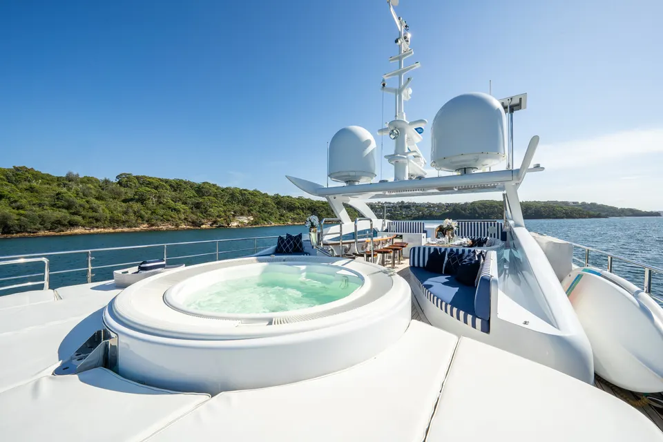 M/Y Lumir, Sun deck spa with the harbour beyond