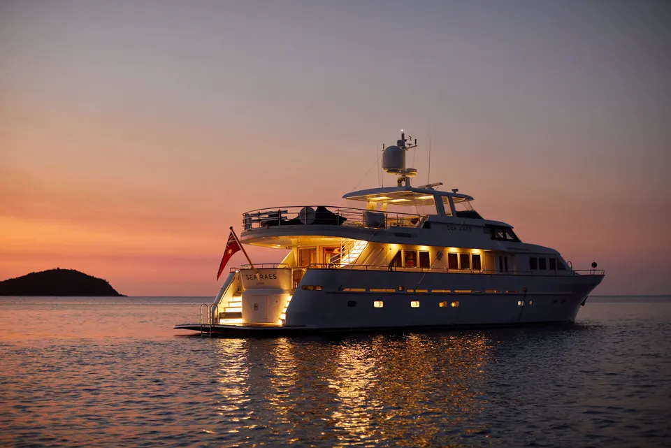 M/Y Sea Raes, lit at dusk
