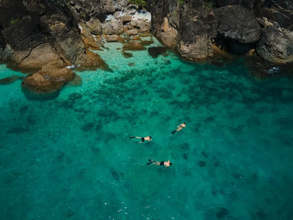 M/Y Sea Raes, snorkelling in a rocky cove, from the air