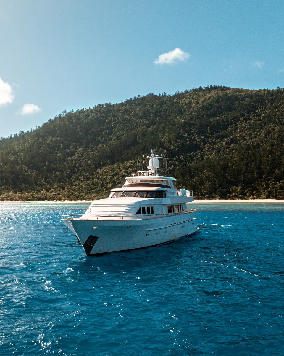 M/Y Sea Raes, off an island beach, from the air